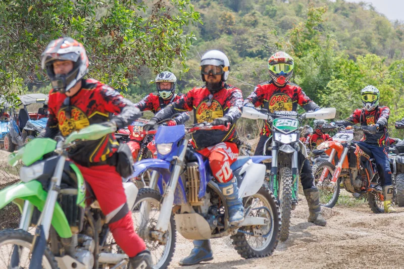Easy Rider riders lined up on dirt bikes at the trail start